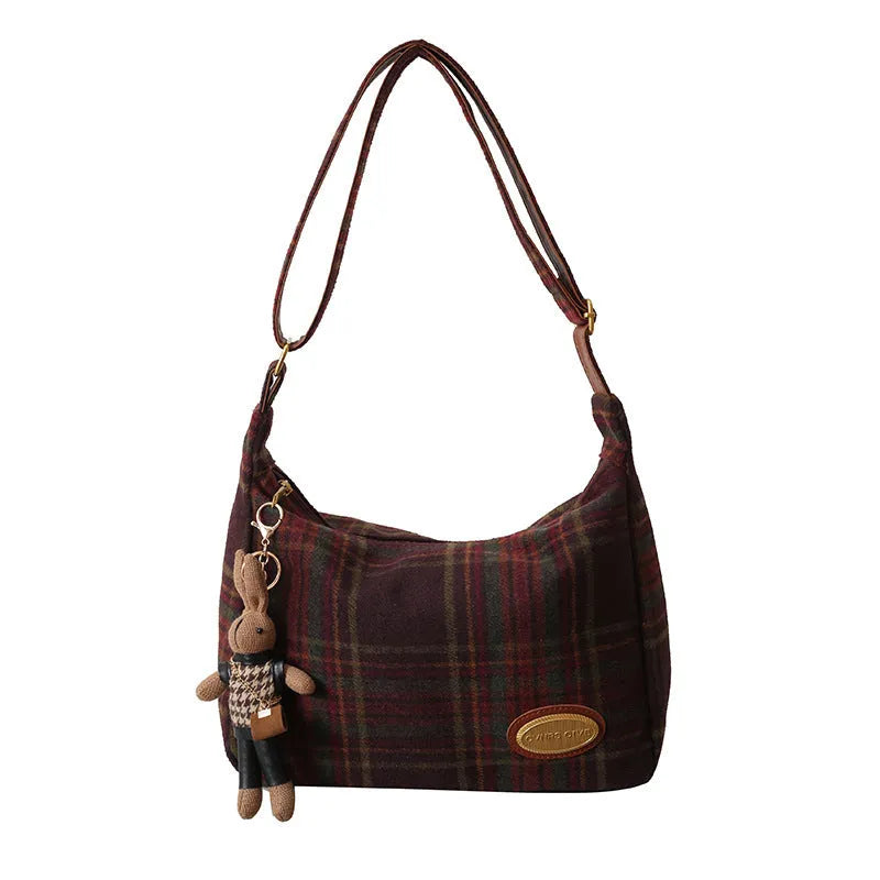 Large capacity soft woolen shoulder bag for women in khaki with pendant, horizontal square shape with sewing line detail.