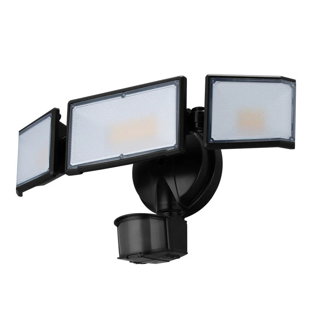 White outdoor LED security floodlight with motion sensor mounted on wall bracket