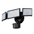 White outdoor LED security floodlight with motion sensor mounted on wall bracket