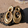 Gold double circle French retro earrings with U-shaped silhouette and quicksand-coloured finish