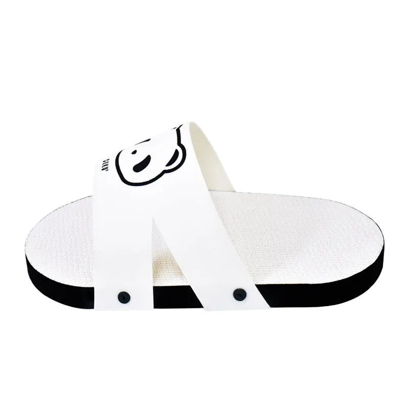 White corrugated cardboard cat scratch board shaped like a slipper on a plain background.