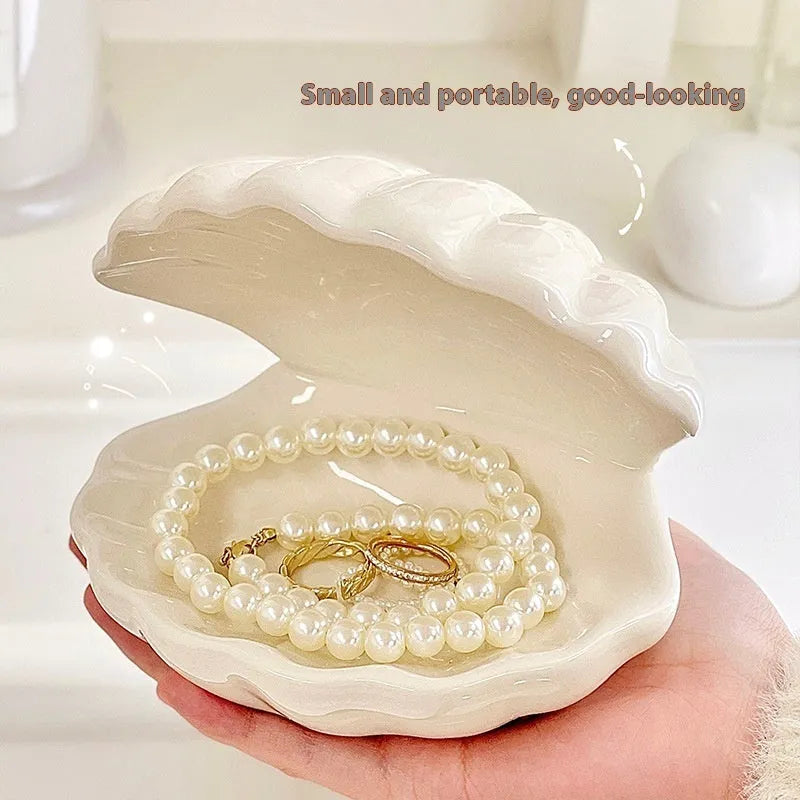 White porcelain girls ornament tray with small night light, shown in yellow and pink shell options.