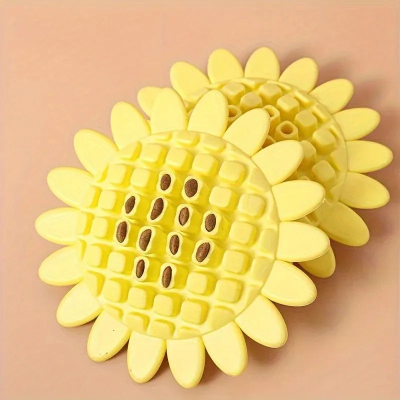 Yellow rubber sunflower dog toy for teething puppies on a light background
