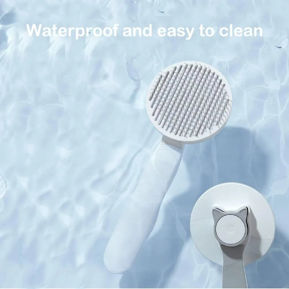 Blue self-cleaning cat brush with a rubber handle and a one-click button for hair removal.