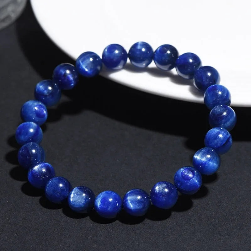 Natural grade 7A blue crystal ball bracelet with geometric beads and a Ruyi charm on a white background.