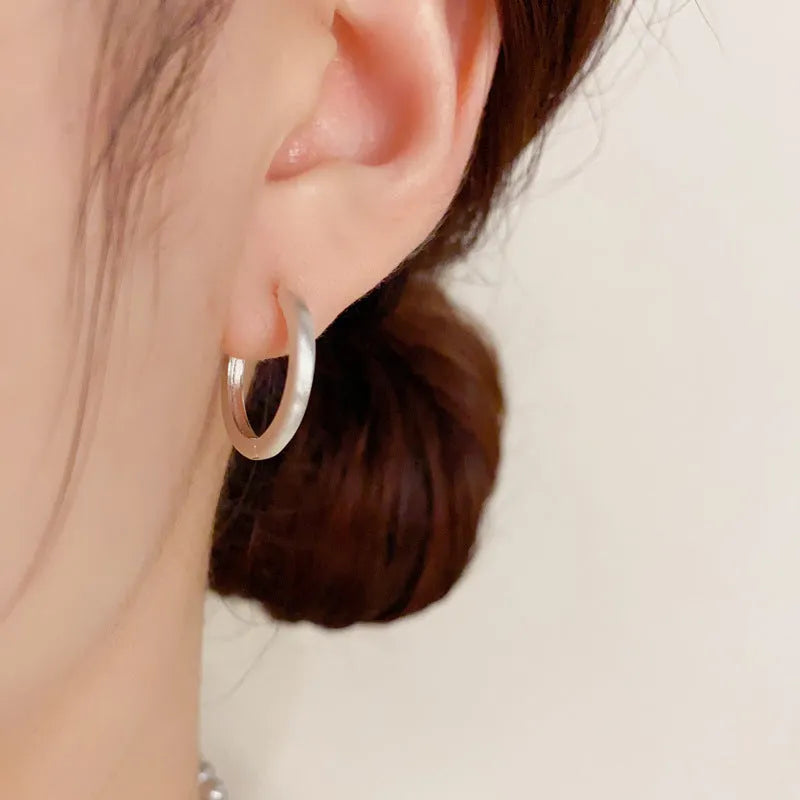 Geometric copper ear clip with real gold plating in simple women's jewellery design