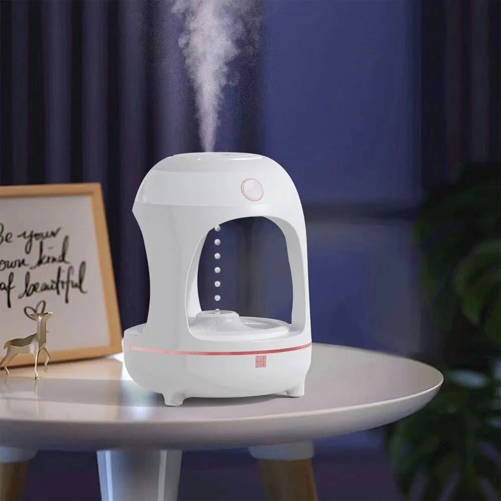 Anti gravity levitating water drops ultrasonic humidifier with LED night light in rose gold and white on a desk