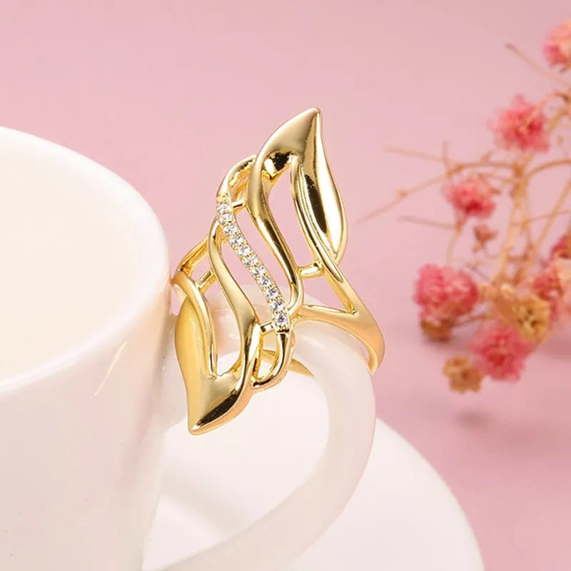 Gold copper casual curve ring for women with zircon decoration on white background