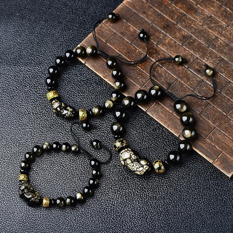 Natural obsidian Pi Xiu bracelet with hand-woven cord and golden sheen on black beads