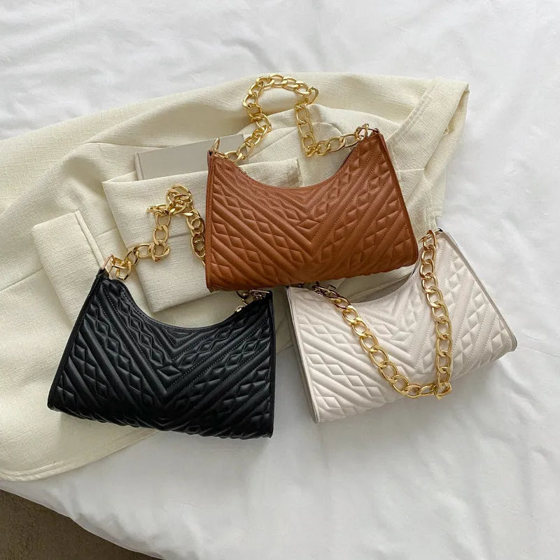 Brown PU leather pleated chain baguette shoulder bag with single strap showing vertical square shape