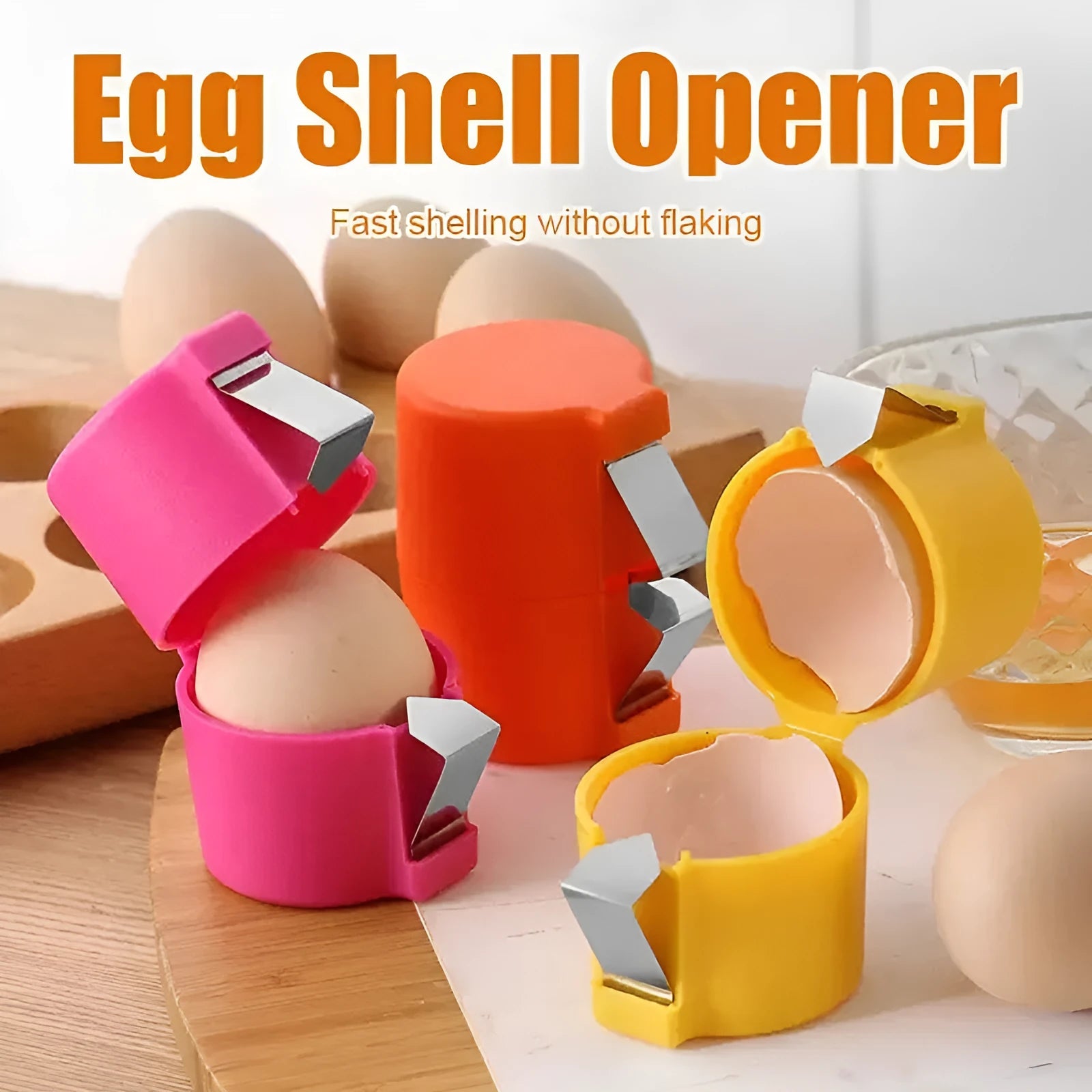 Stainless steel egg shell opener in orange red with PP plastic handle on a kitchen counter