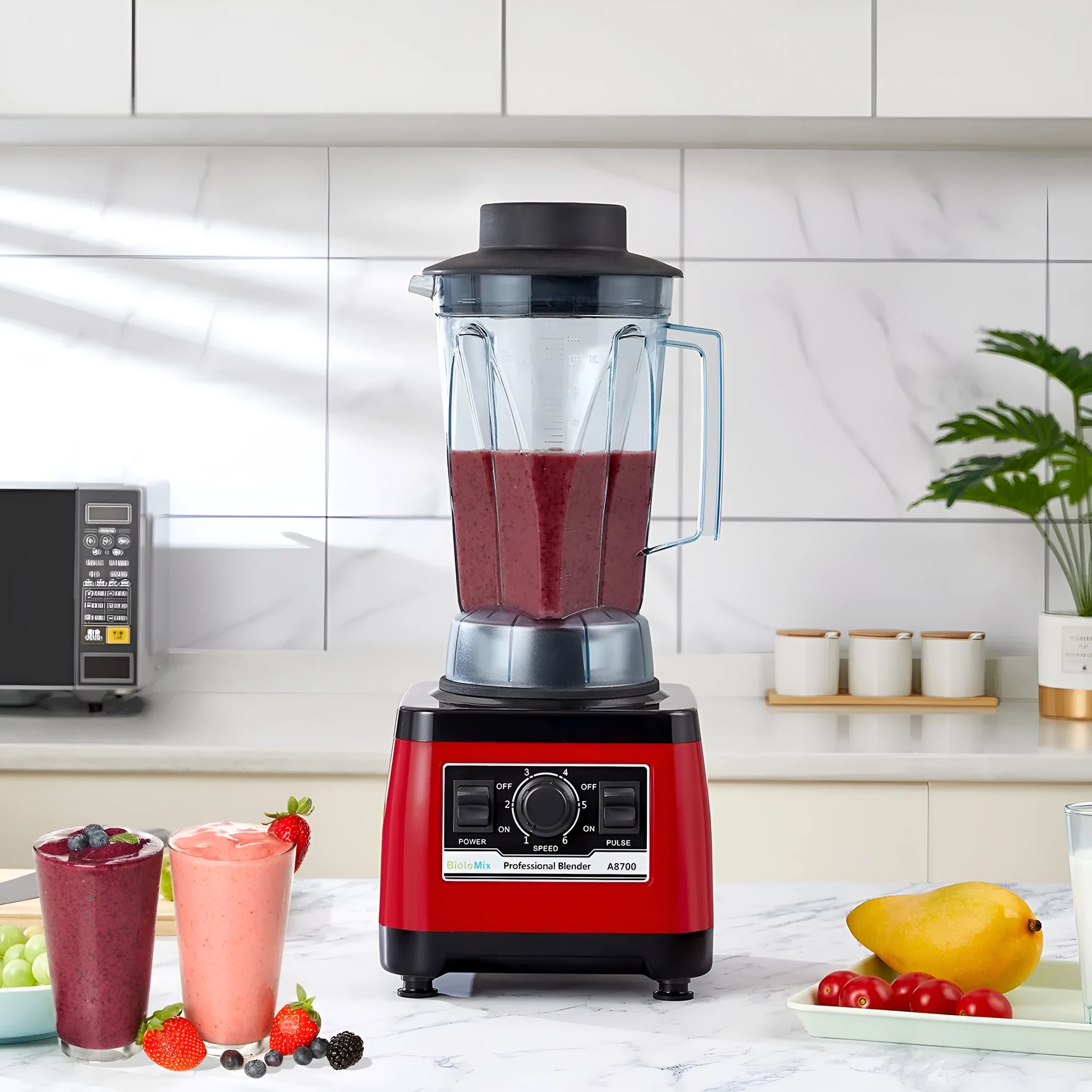 Red commercial blender with 2L stainless steel jug and 2200W motor for professional kitchen use