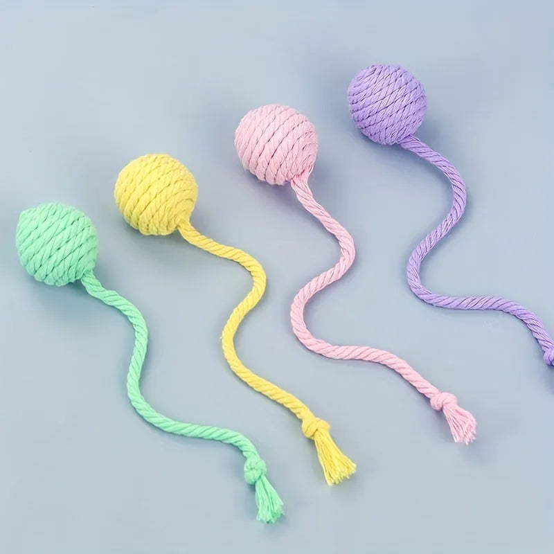Cat toy ball with rope handle and bell inside in bright colours for kitten play