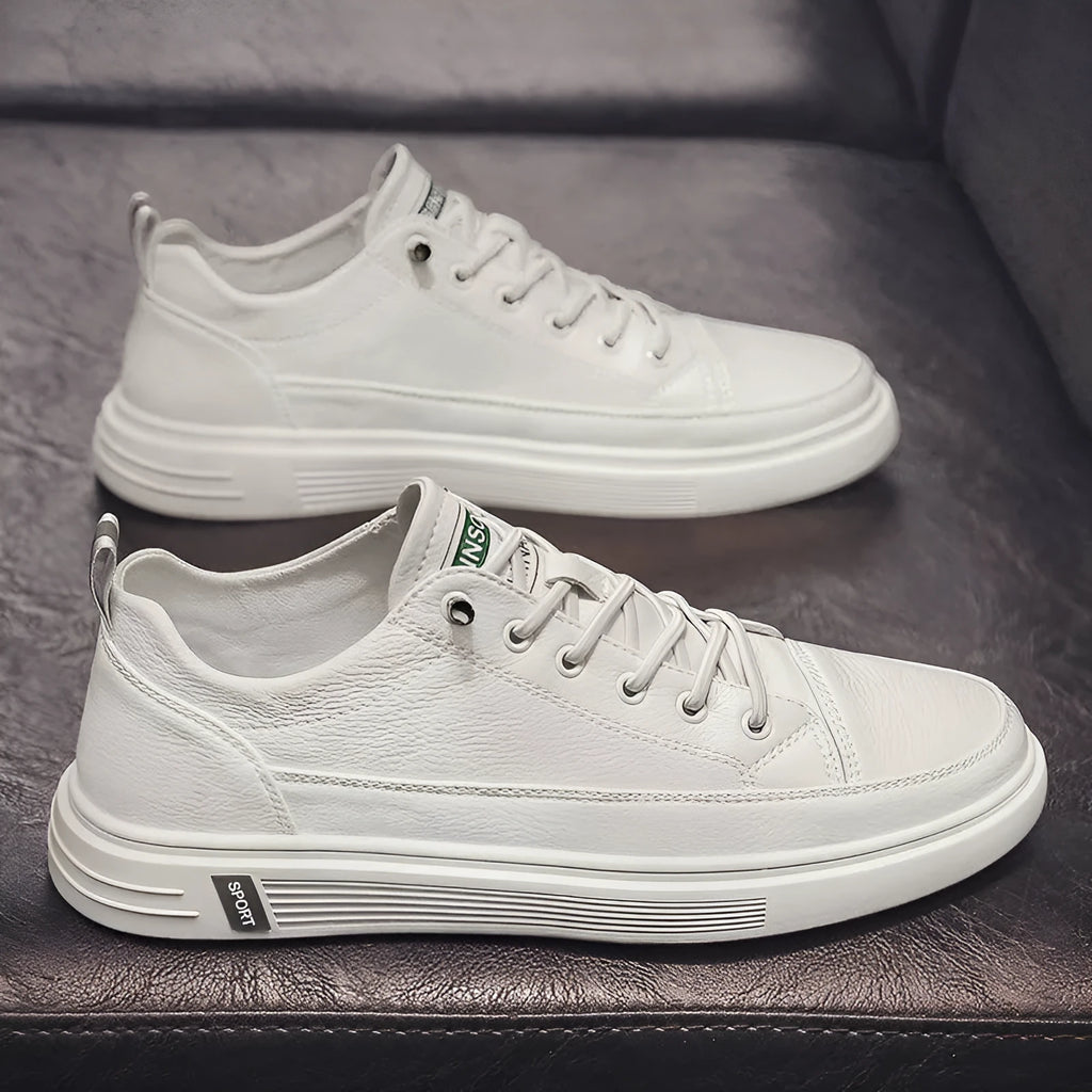 White casual men's shoes with round toe and flat low-heel design on neutral background