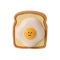 Cute cartoon pattern latex dog toy in egg bread shape, bite resistant squeaky chew toy for puppies, yellow and green