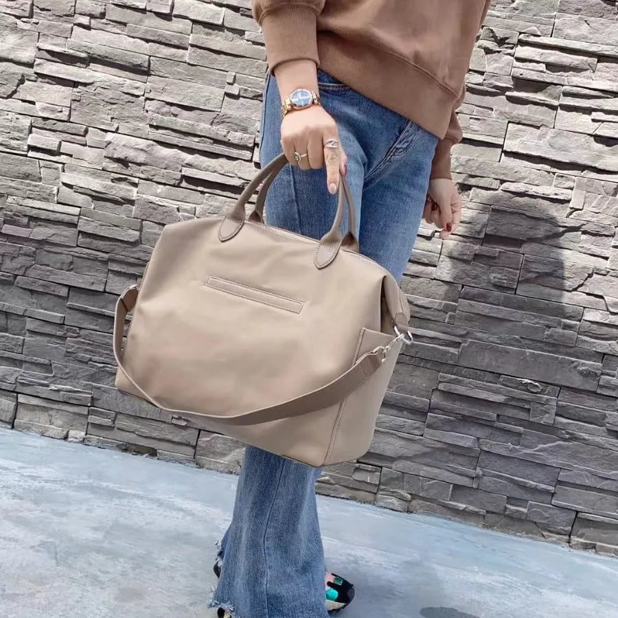 Nylon waterproof cloth shoulder bag with large 35x14x27cm capacity in black, simple design, front view