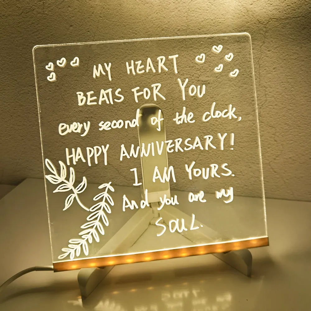 Acrylic DIY note board LED night light with pens on desk, showing written message and soft glow