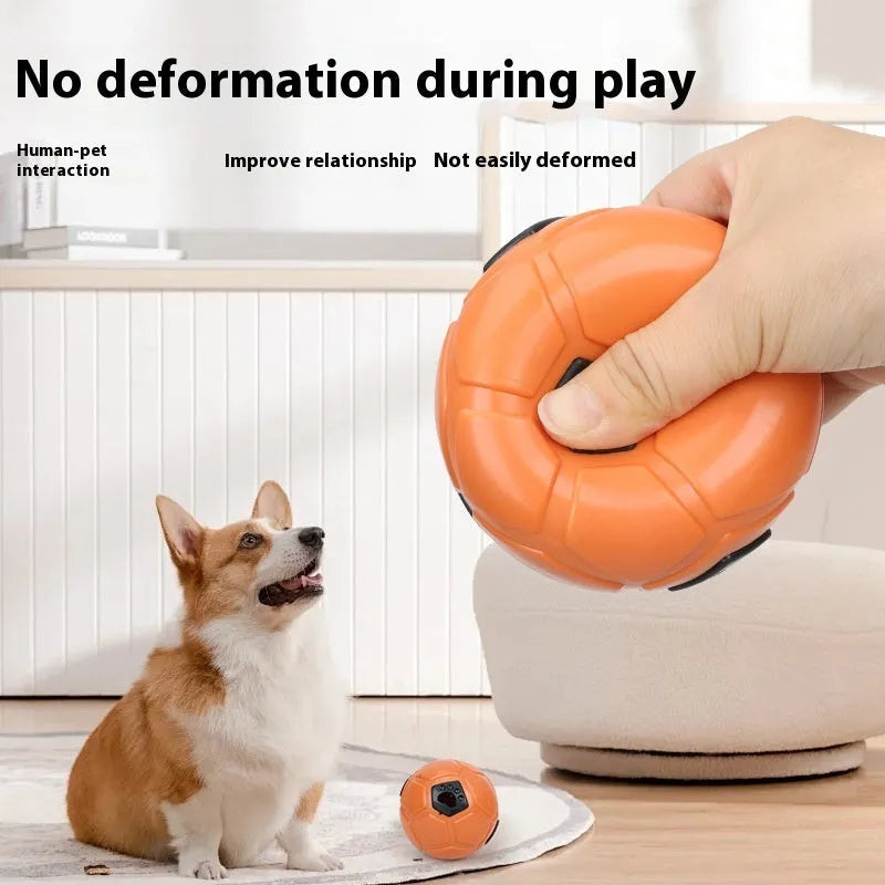 Orange hollow style TPR dog toy ball for nibbling and teeth grinding on a neutral background