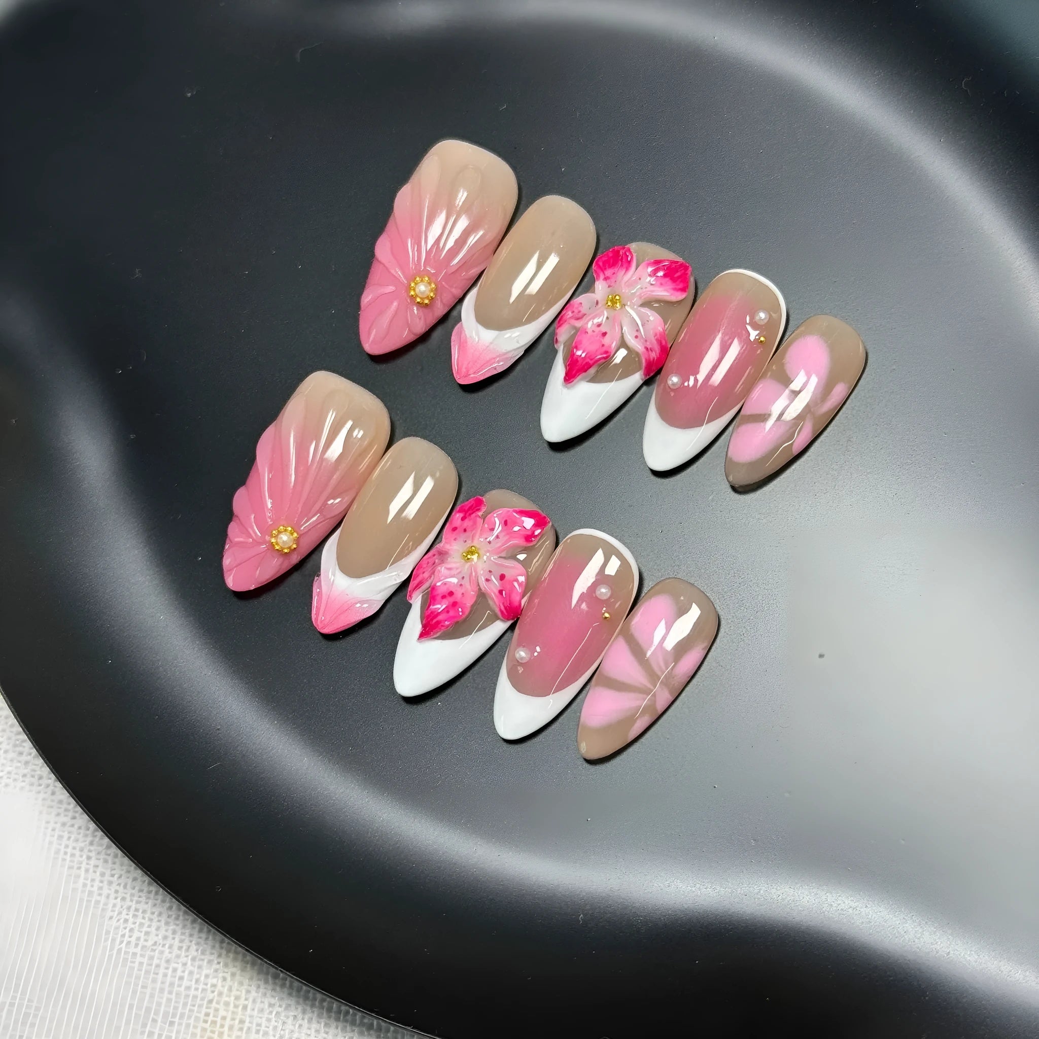French style artificial nails with 3D lily and ice flower design on almond-shaped plastic tips.