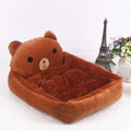A blue cartoon-style sofa bed for a small dog or cat, with soft raised sides.