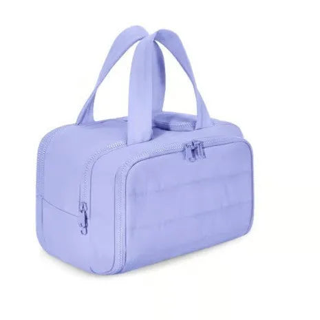 Large lightweight travel toiletry bag in beige colour with wide open top showing spacious interior.