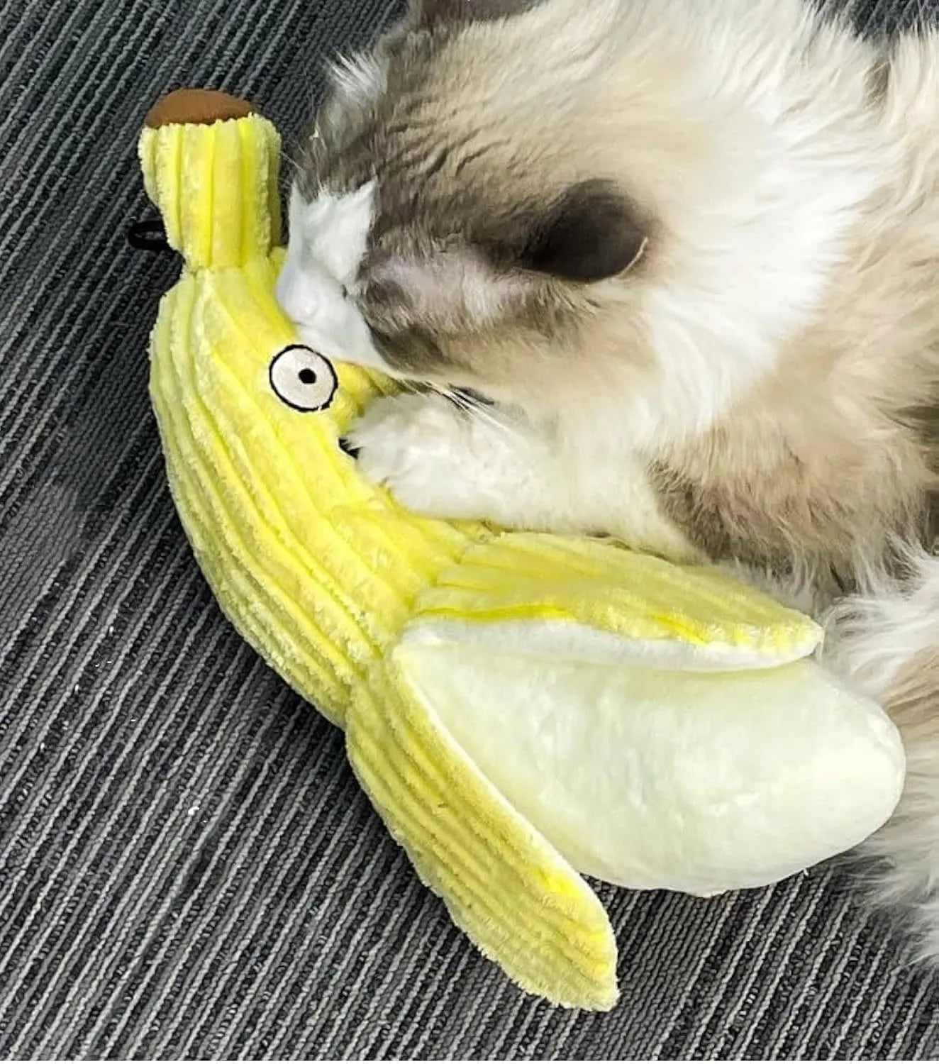 Yellow banana-shaped cat crinkle toy with plush fabric and visible texture details