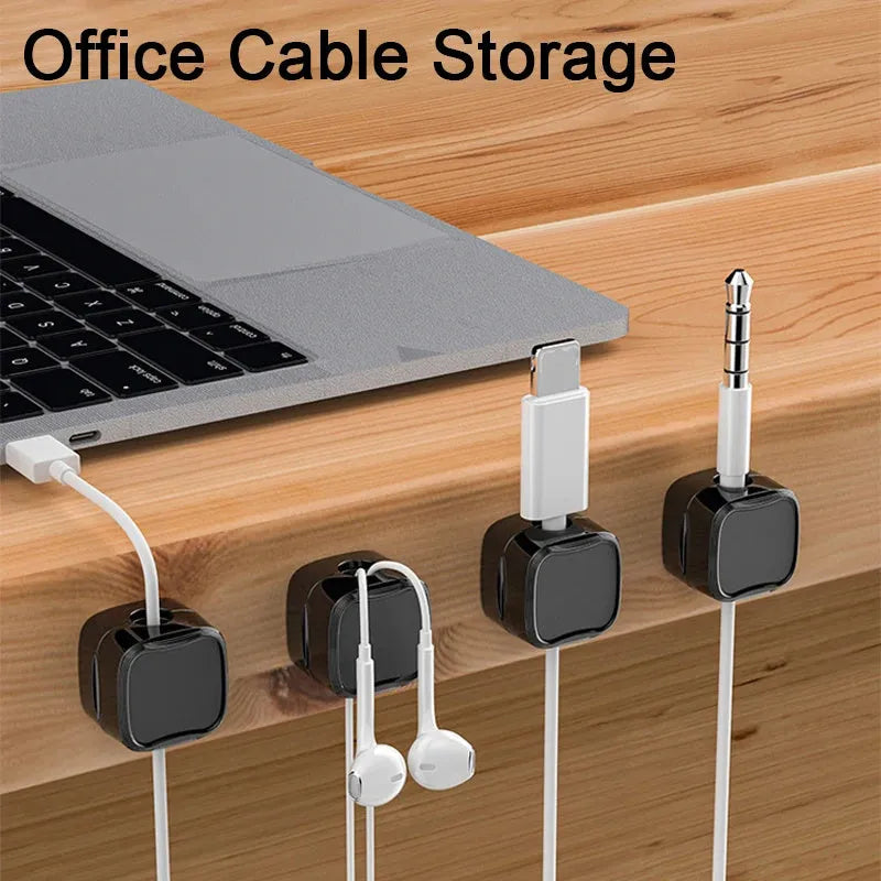 White and black cable clips holding under desk wires including USB and HDMI cables