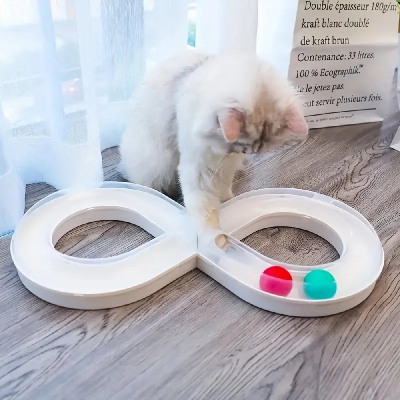 Blue cat turntable toy with rotating ball track and feather teaser wand on floor