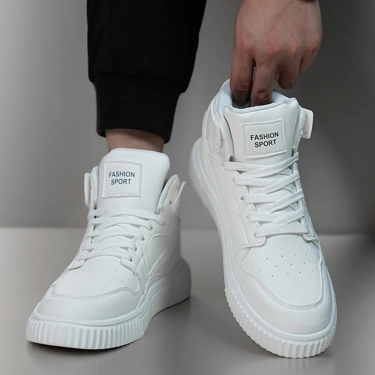 Men's white round toe casual sneakers with a microfiber upper on a grey background.