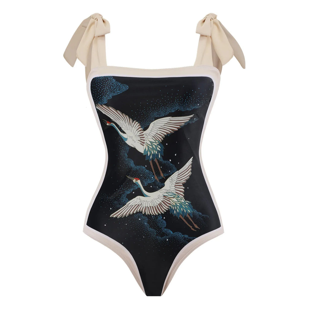 Retro women's one-piece swimsuit with a chiffon skirt in a floral pattern.