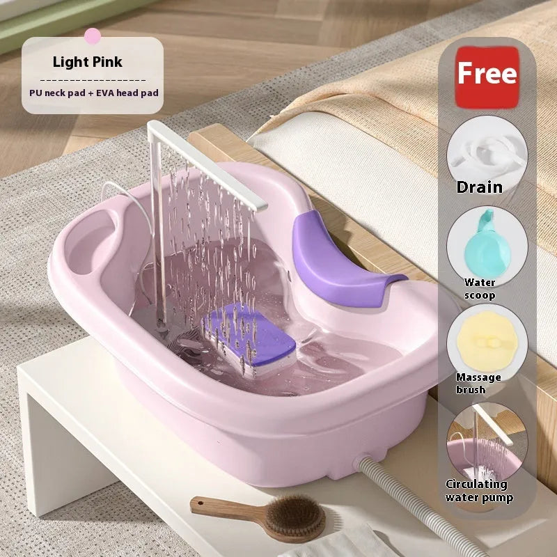 Portable plastic bed shampoo basin set with head pillow, water pump, and accessories in light pink colour.
