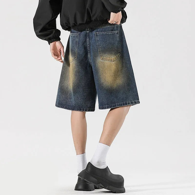 Retro blue denim jeans with ripped detailing, loose straight-leg fit, American high street street style.