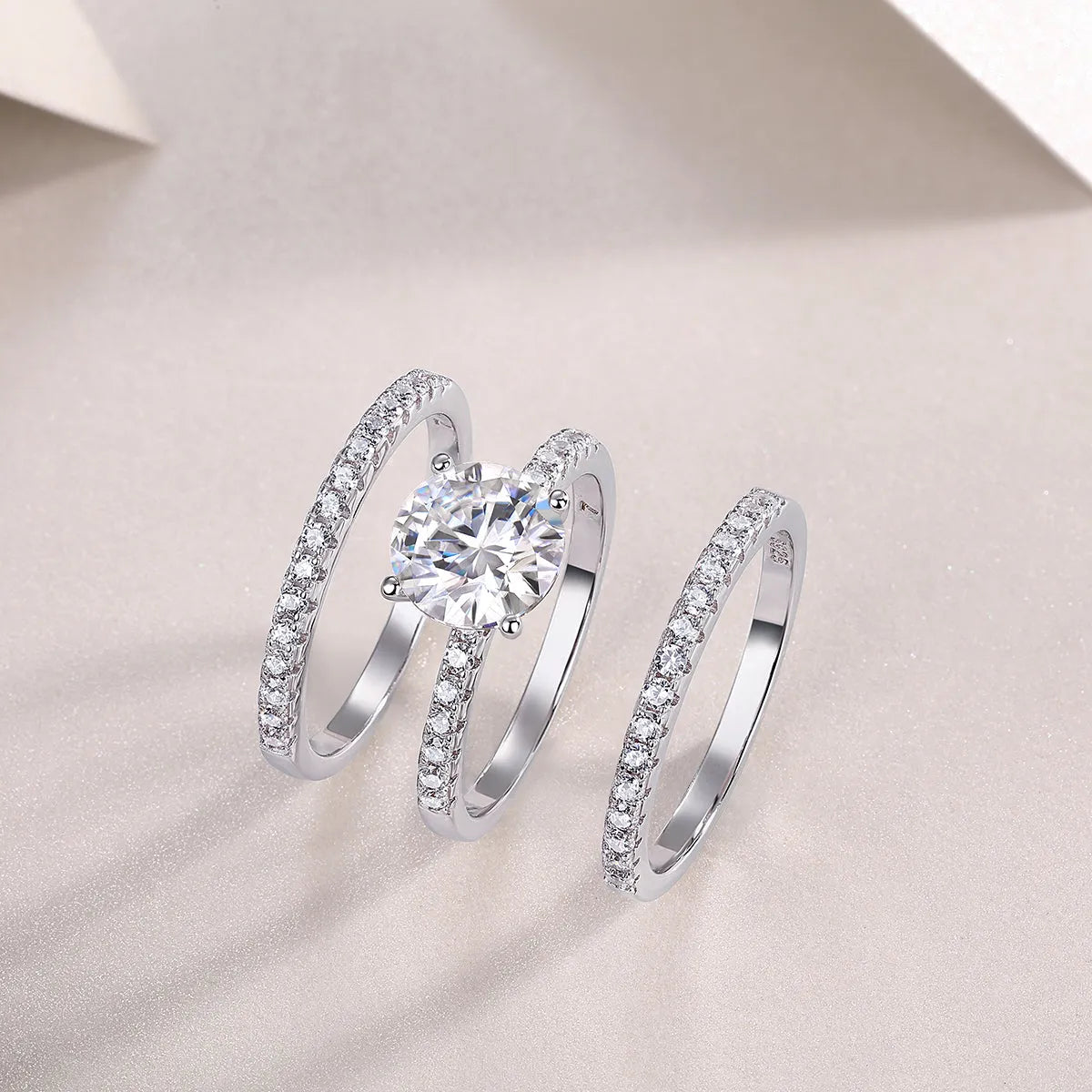 Dreamy 2-carat moissanite wedding ring set on white background, S925 silver platinum-plated band