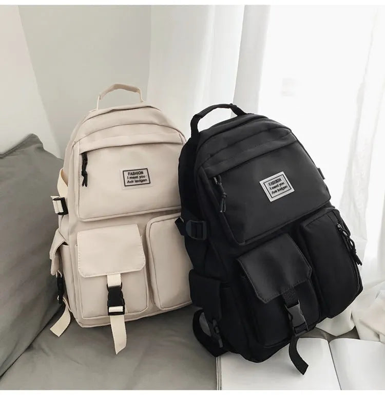 Soft nylon student backpack with computer compartment and three-dimensional pockets in black colour