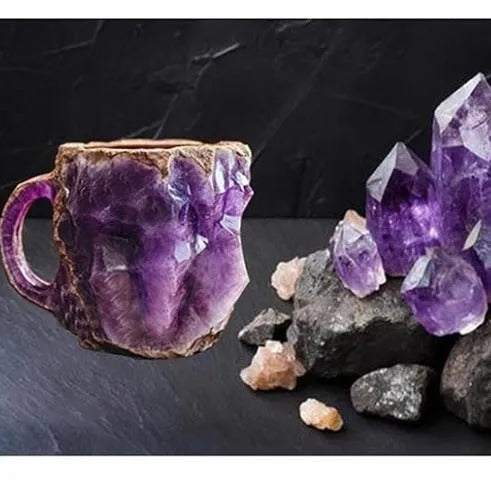Purple resin coffee mug with 3D crystal texture and a handle on a wooden table.