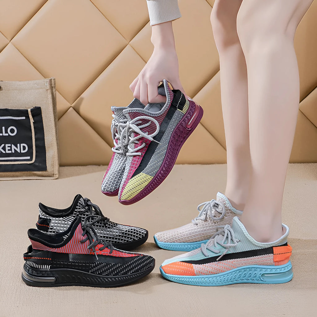 Women's lightweight breathable lace-up running shoes in black with round toe and low top profile