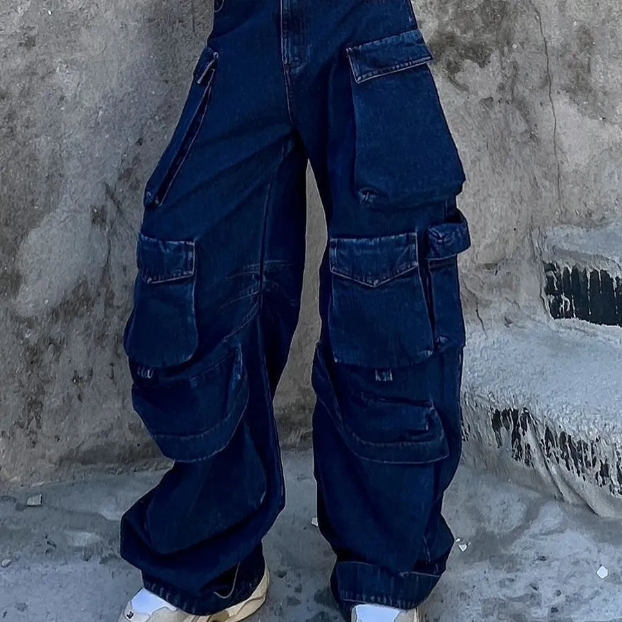 Dark blue distressed wide-leg high-waist jeans with multiple pockets on a street fashion model