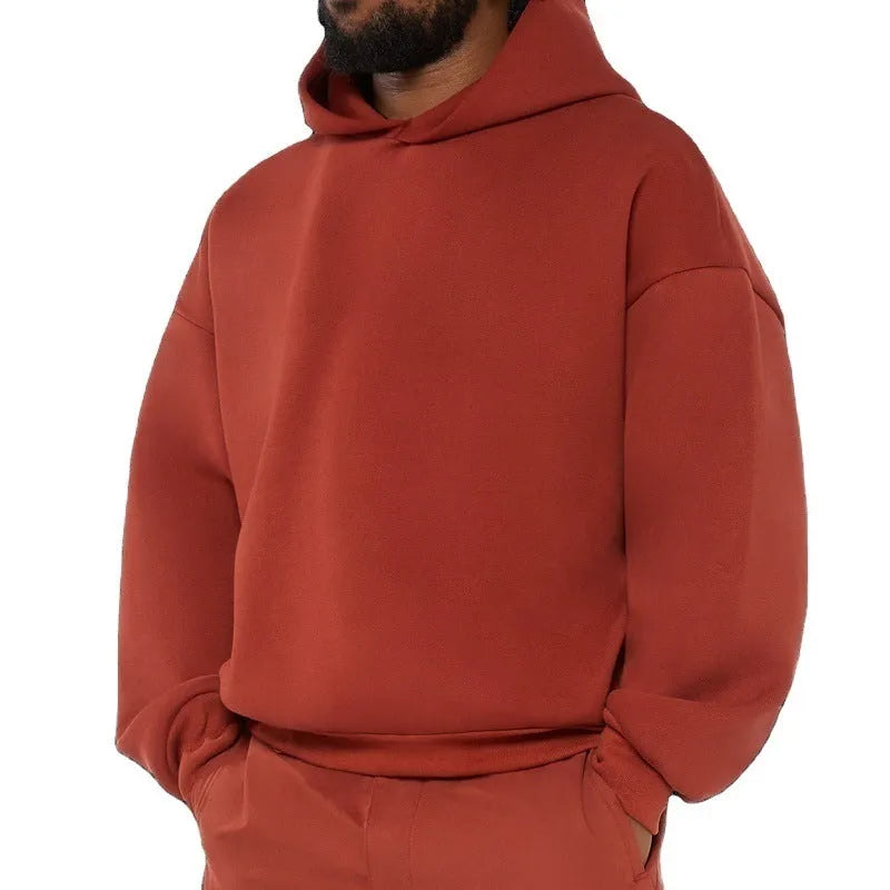 Men's grey cotton pullover hoodie with a fleece wool lining and long sleeves.