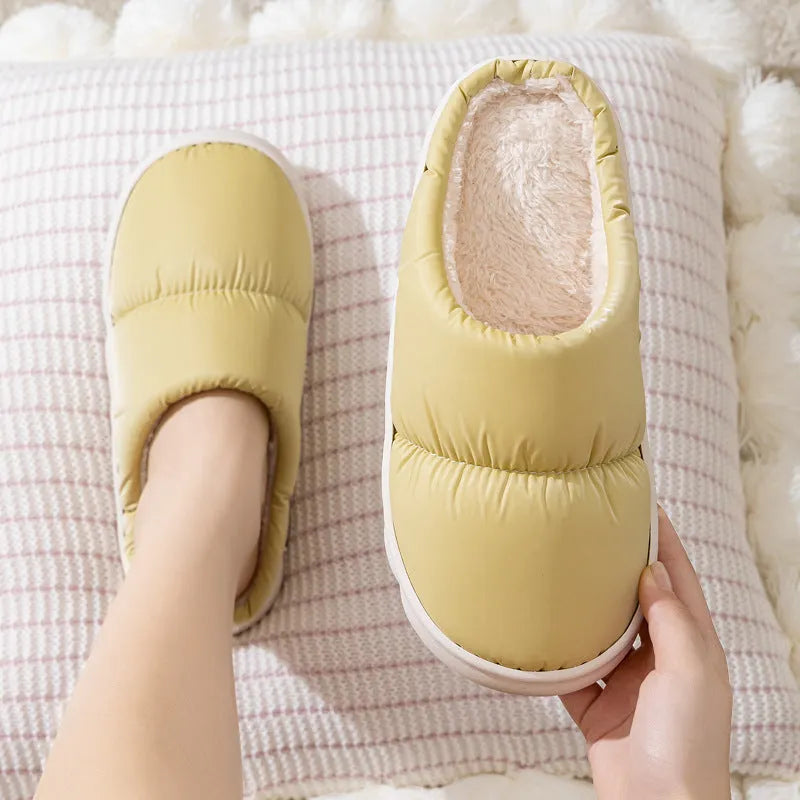 Blue winter house slippers with artificial leather upper, thick rubber sole, and plush lining.