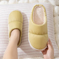 Blue winter house slippers with artificial leather upper, thick rubber sole, and plush lining.