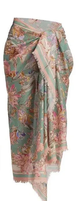 Women's floral print bikini set with skirt in creamy-white beige, shown on a mannequin