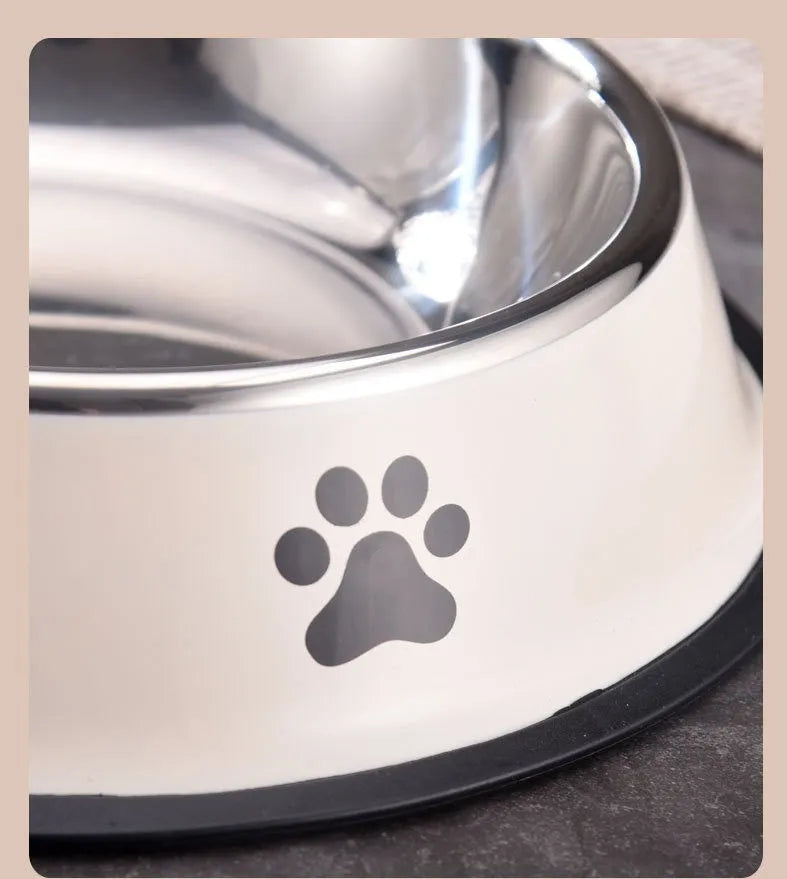 Printed non-slip stainless steel pet bowl for dogs and cats in gray, shown on a floor