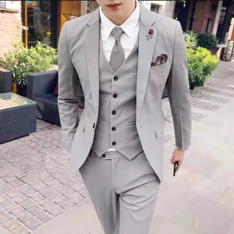 Men's three-piece slim fit Korean style business suit set in black with jacket, trousers, and tie