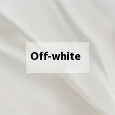 Solid colour silk duvet cover in Lotus Pink showing plain weave texture on a bed.