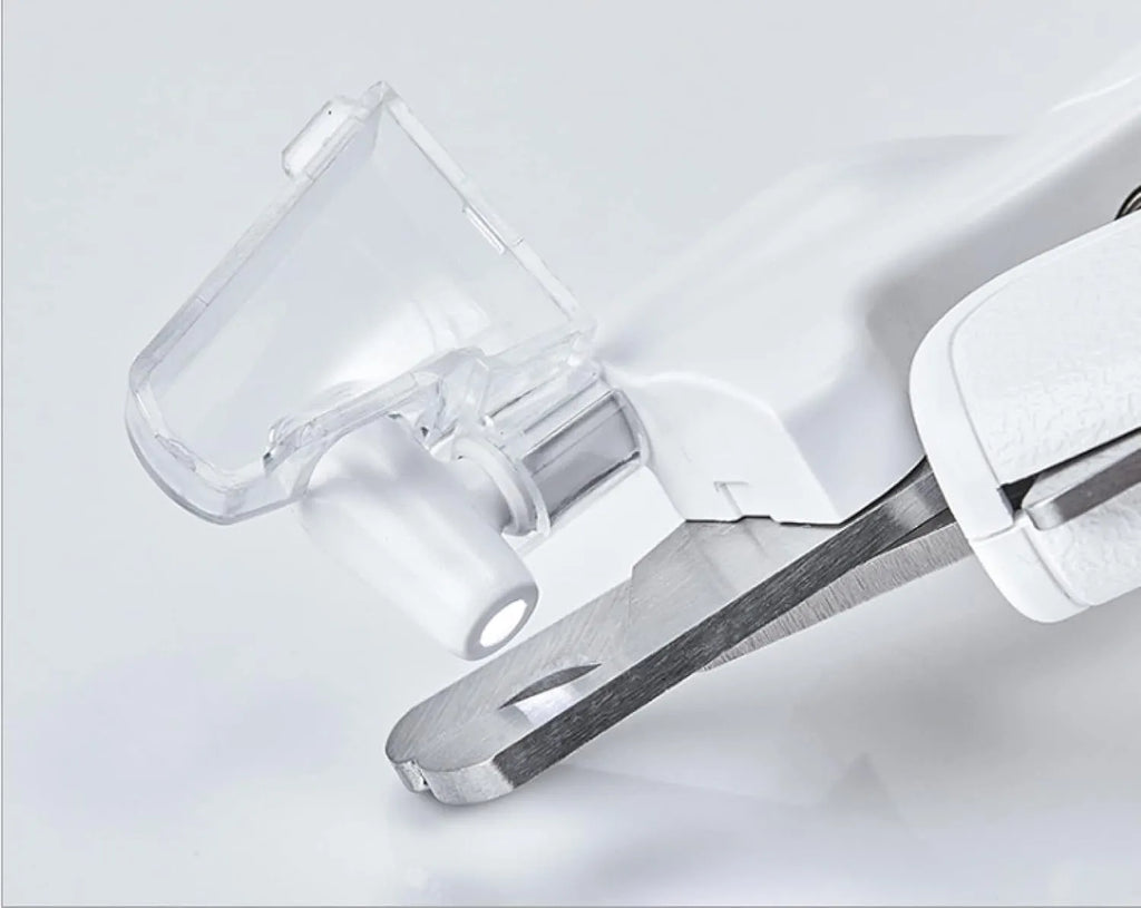 White pet nail clippers with LED light, transparent anti-splash guard, and a leather-like handle.
