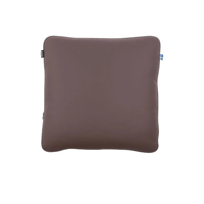 Minimalist brown synthetic fibre headrest cushion and neck pillow for a Volvo car seat.