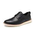 Men's black and brown slip-on business casual shoes with round toe and carved pattern detail