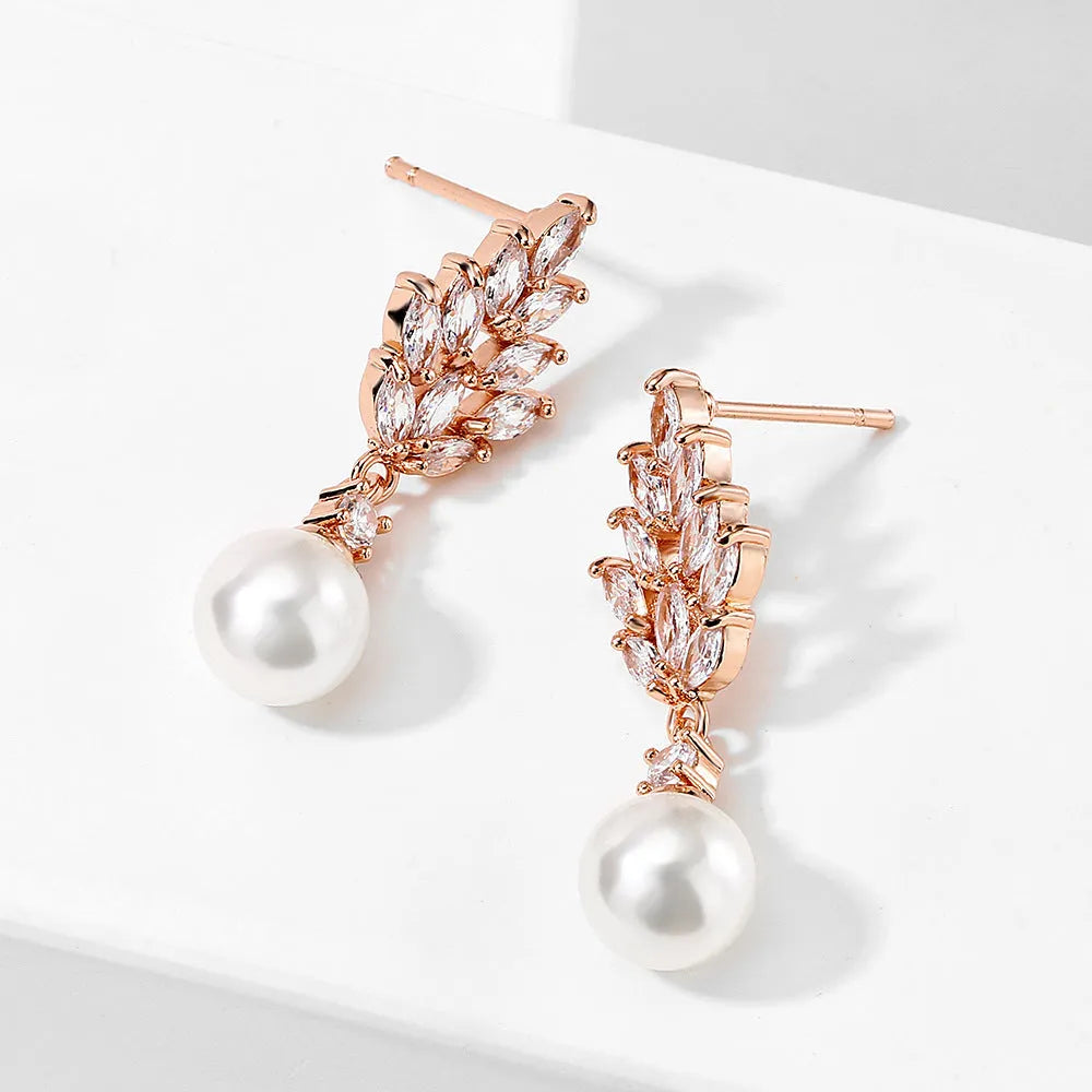 Geometric copper earrings with micro inlaid zircon and flower detail in gold plating
