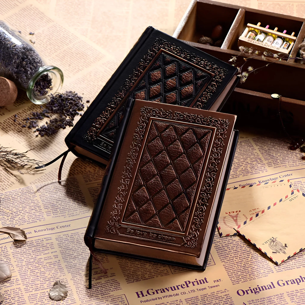 Embossed faux leather notepad showing three-dimensional geometric pattern in bronze colour with thick paper pages