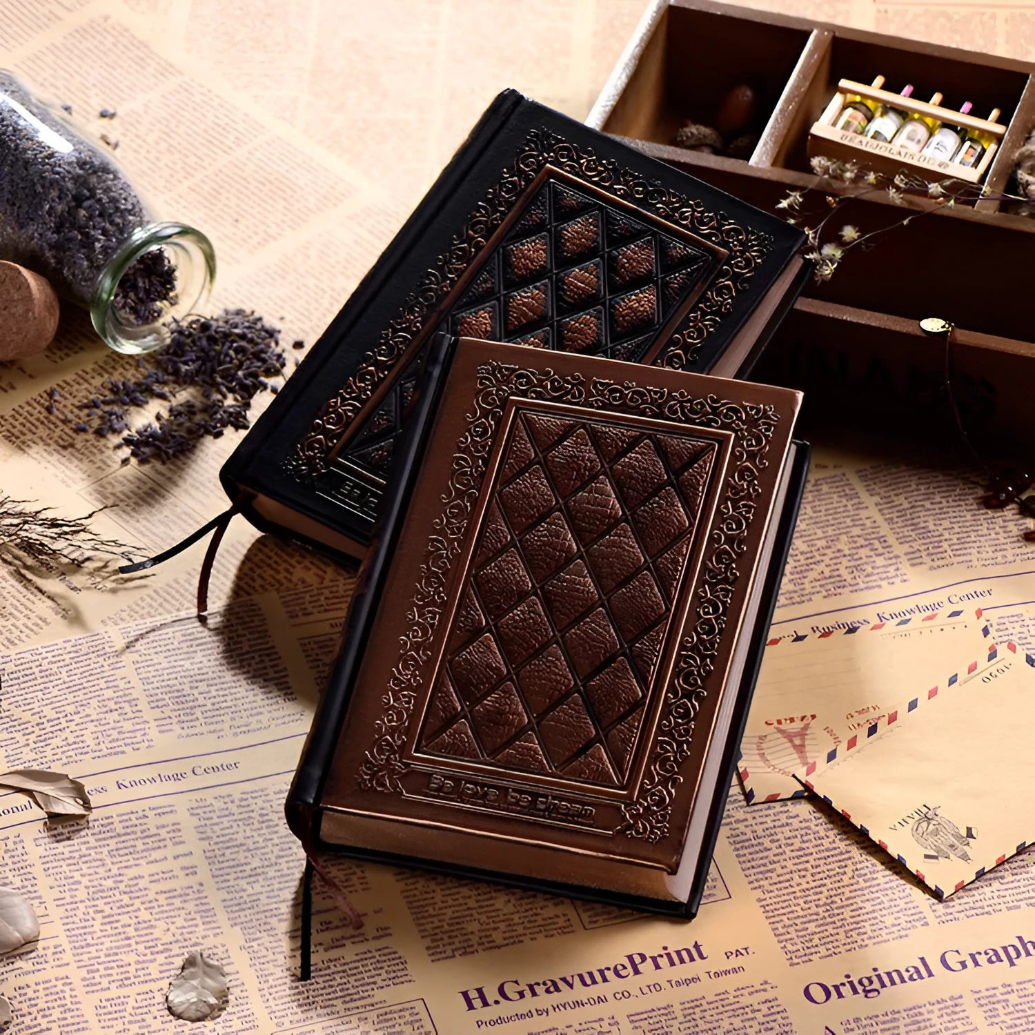 Embossed faux leather notepad showing three-dimensional geometric pattern in bronze colour with thick paper pages